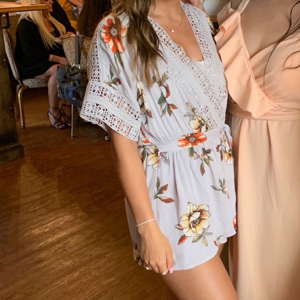 Floral print romper with crochet detailing